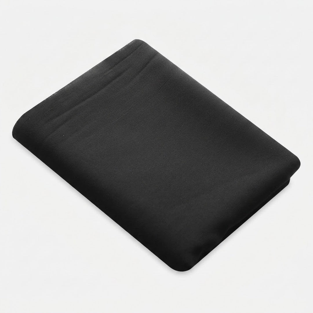 A folded black fabric sheet or pillowcase on a light gray background.