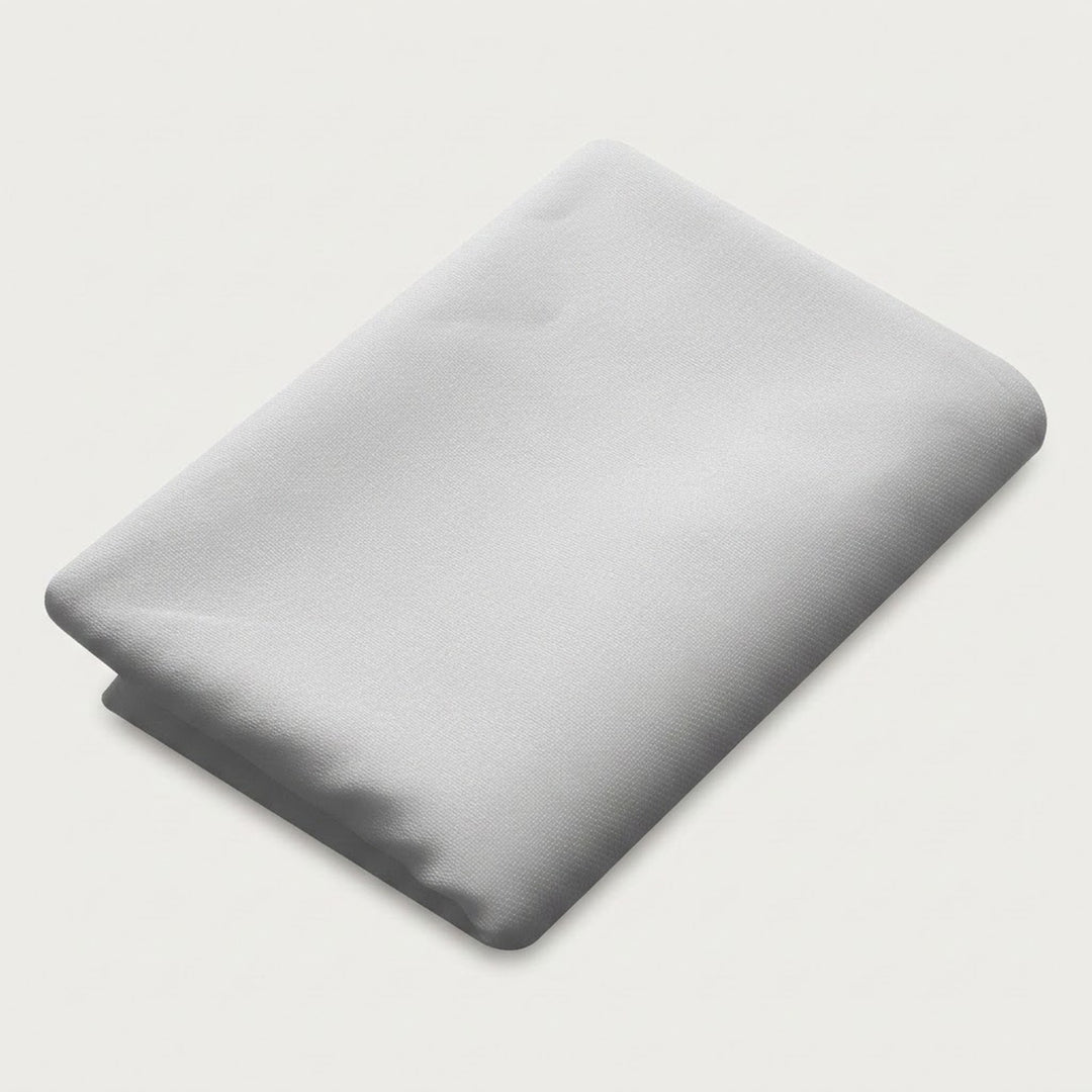 A folded light gray fabric item, likely a sheet or blanket, shown on a plain off-white background.
