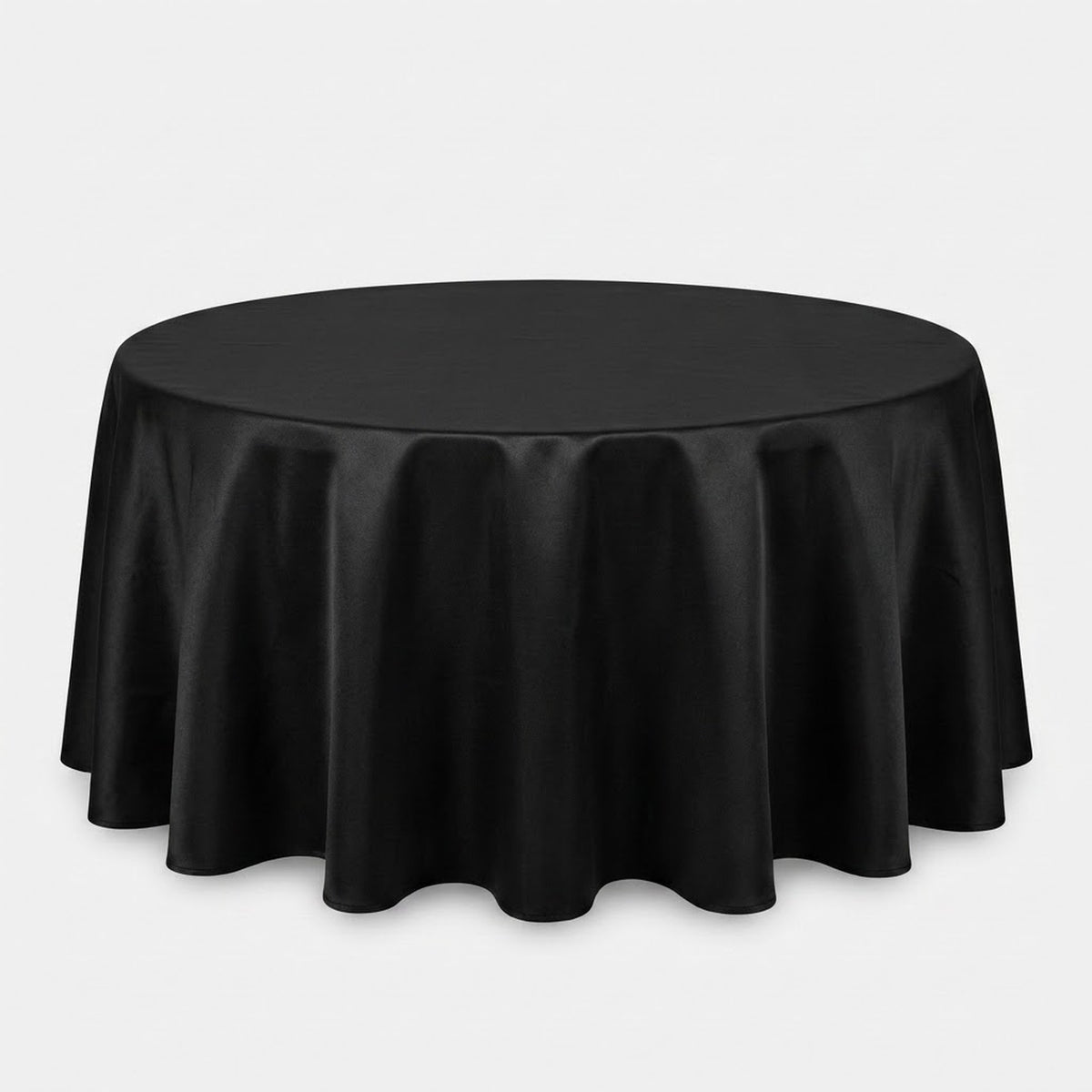A round black tablecloth draped over a circular table, shown against a plain light gray studio background.