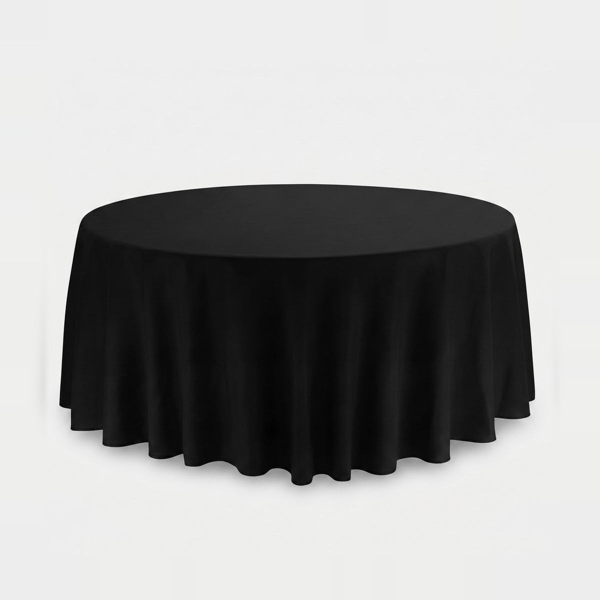 A round black tablecloth draped over a circular table, shown against a plain light gray studio background.