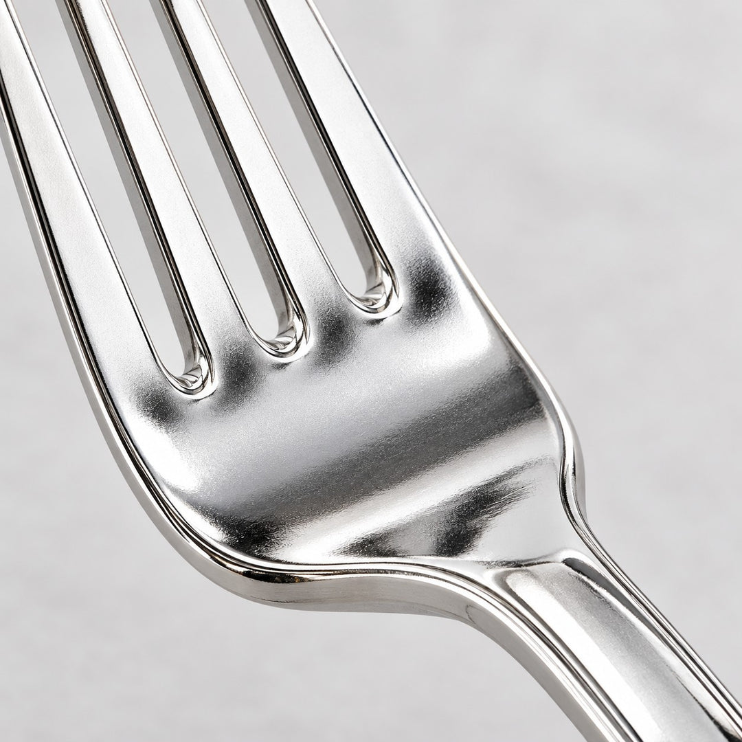 A macro view shows the smooth reflective electroplated finish on a silver fork.