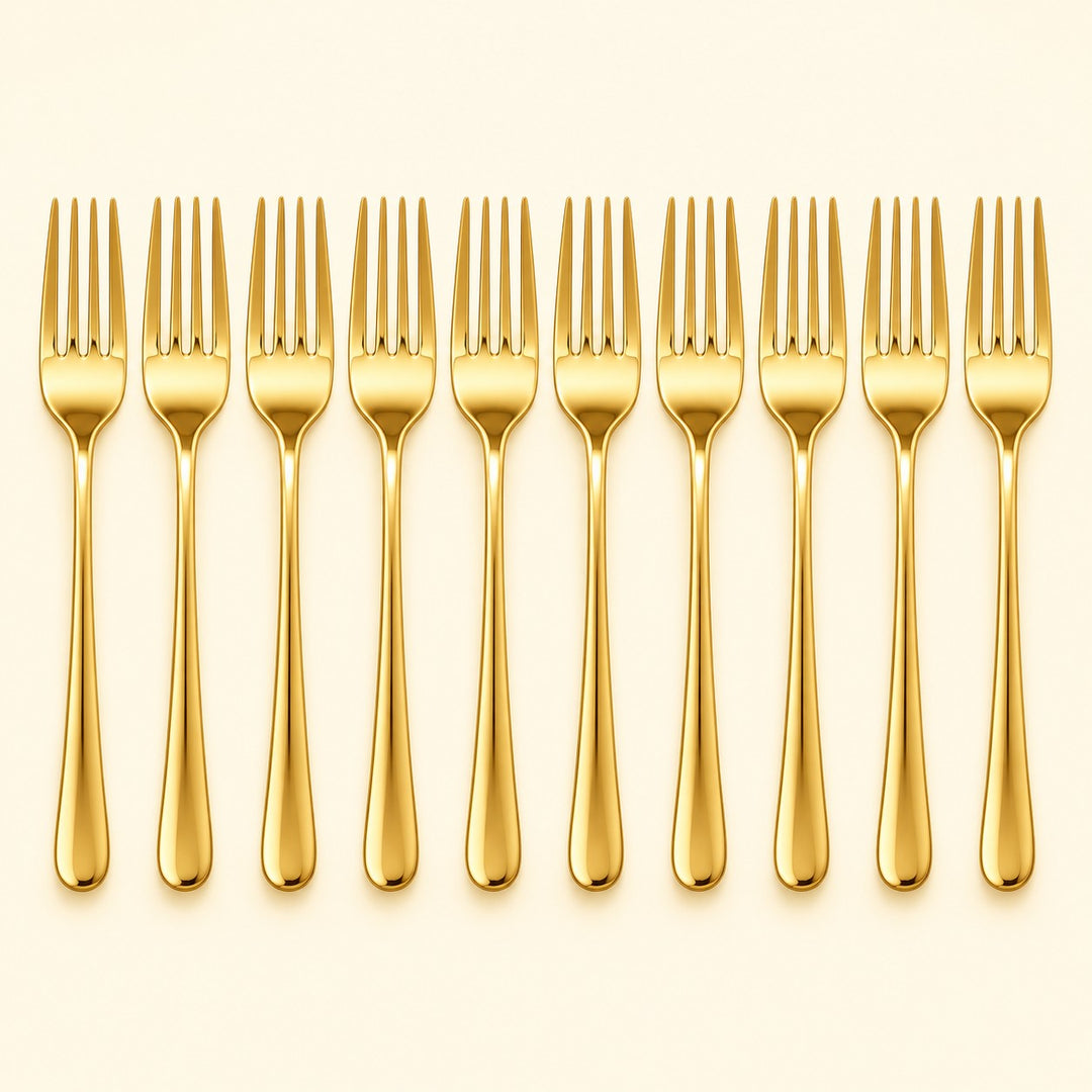 Ten gold disposable forks stand in a row against a pale gold studio background.