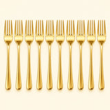 Ten gold disposable forks stand in a row against a pale gold studio background.