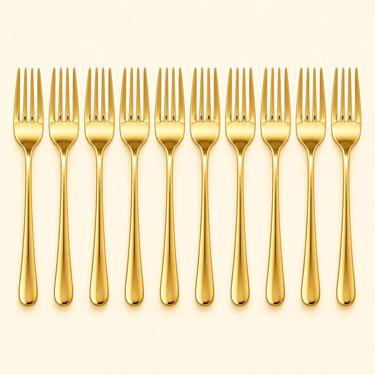 Ten gold disposable forks stand in a row against a pale gold studio background.