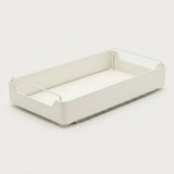 A minimalist white plastic organizer tray with integrated wire handles on the sides, shown on a seamless light gray background.