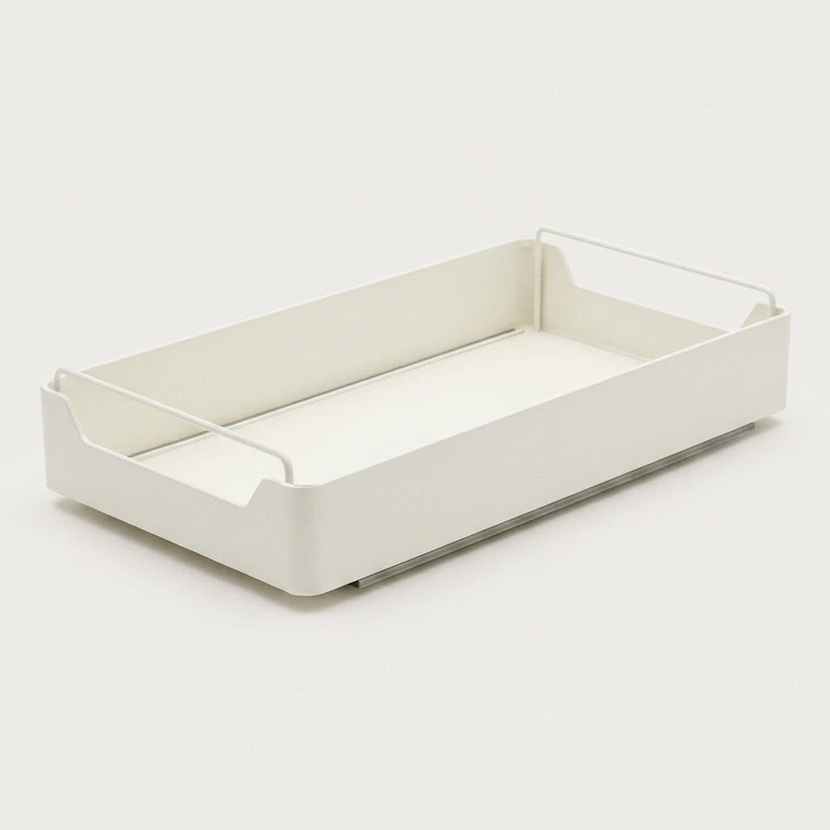 A minimalist white plastic organizer tray with integrated wire handles on the sides, shown on a seamless light gray background.