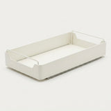 A minimalist white plastic tray with integrated wire handles on the sides, shown on a seamless light gray background.