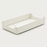 A minimalist white plastic storage tray with integrated wire handles on a clean, light off-white background.