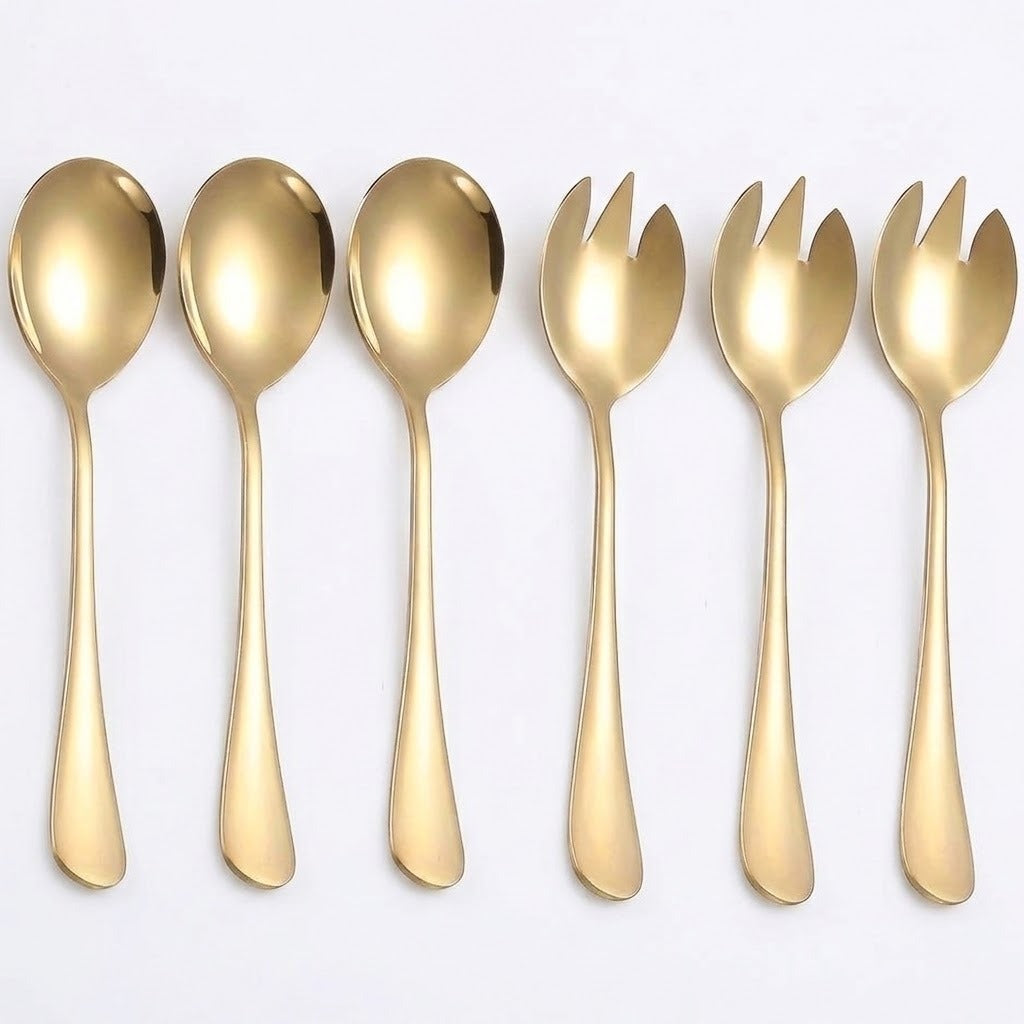 A set of six gold-colored flatware utensils, including four spoons and two forks, arranged in a row against a plain white background.