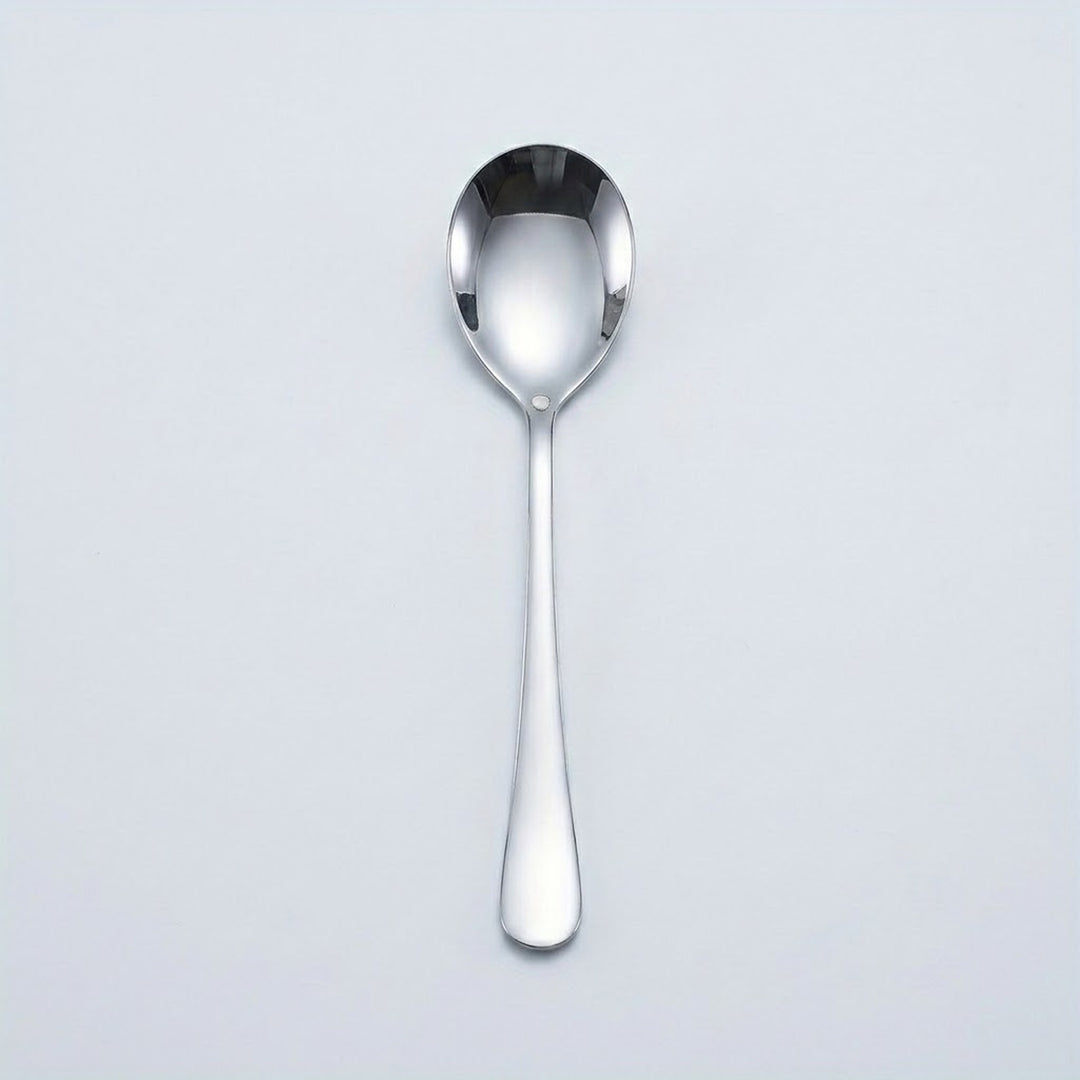 A polished stainless steel dessert spoon with a reflective finish, centered vertically against a light gray background.