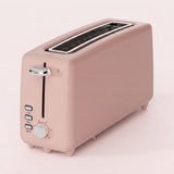 A retro-style two-slot toaster in a matte dusty pink color, featuring a silver lever handle, silver control buttons, and a silver rotary dial on the front panel, set against a solid pale pink background.