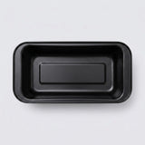 A black rectangular shallow tray with rounded corners, photographed from directly above on a light gray background.