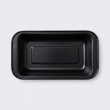 A black rectangular shallow tray with rounded corners, photographed from directly above on a light gray background.