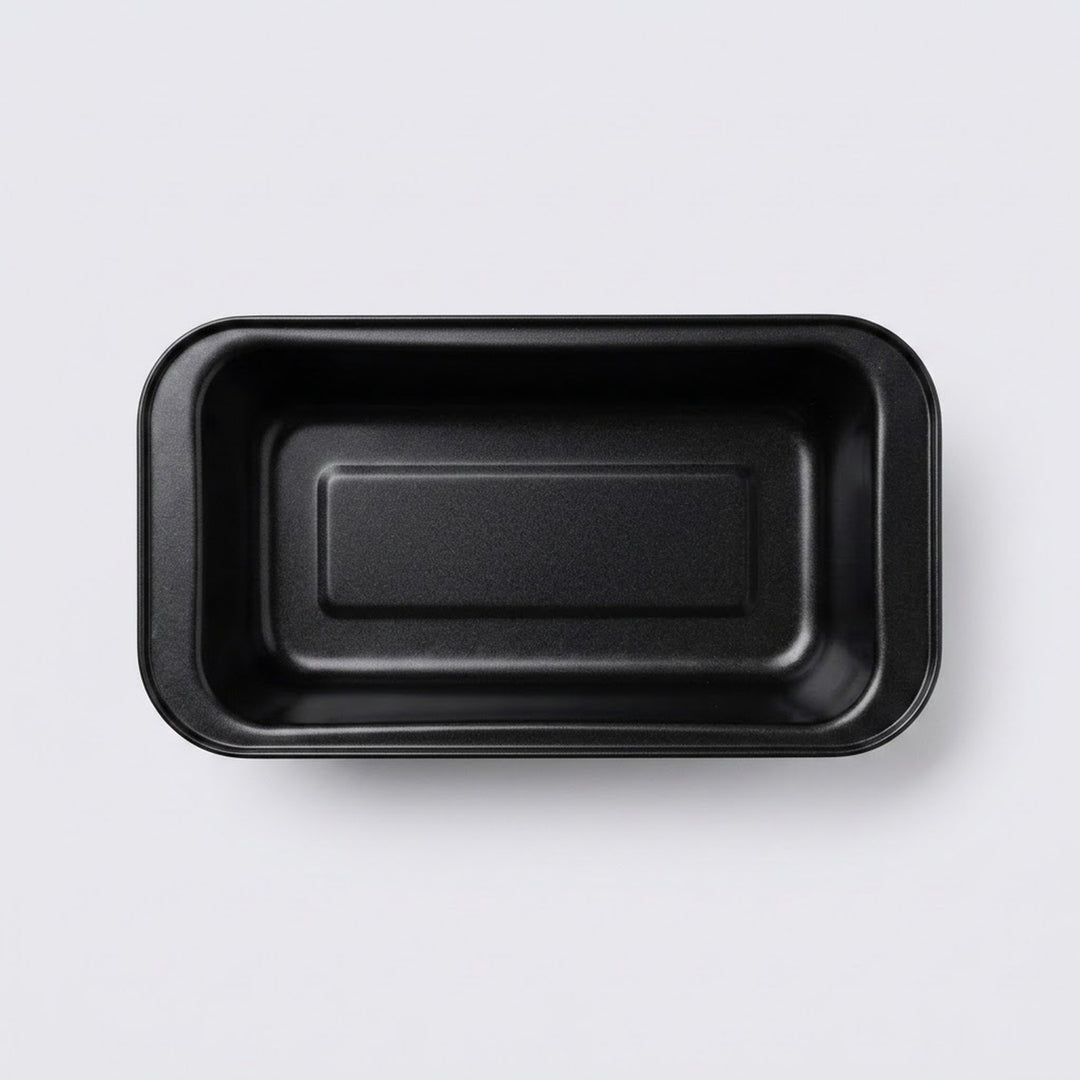 A black rectangular shallow tray with rounded corners, photographed from directly above on a light gray background.