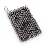 A rectangular silver chainmail or chainmail-style mesh pouch with a small metal ring attachment, photographed on a plain white background.