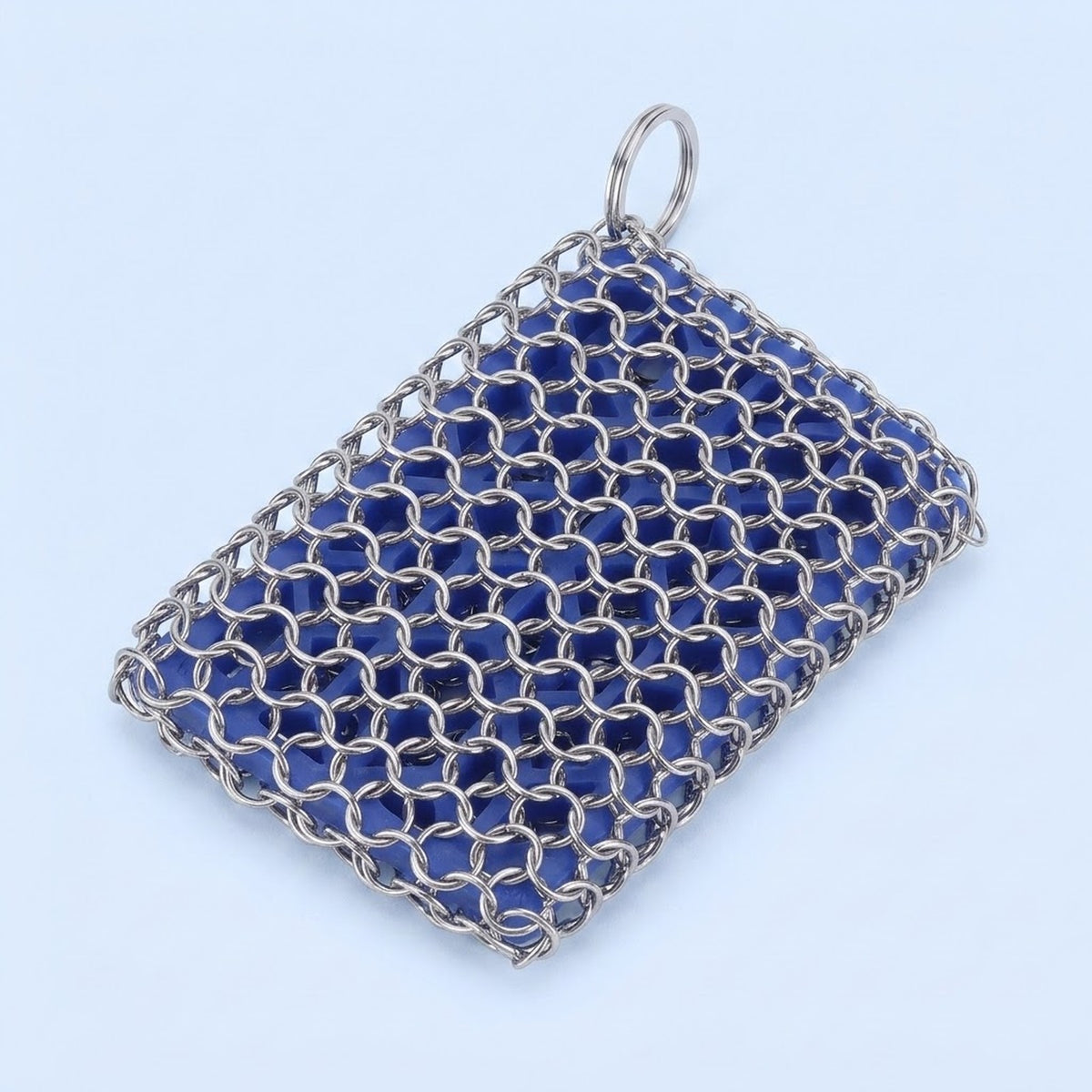 A rectangular silver chainmail mesh pouch with a top loop, filled with dark blue faceted beads, shown on a light blue background.