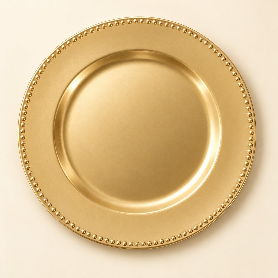 Single Gold Beaded Charger Plate centered on a pale champagne backdrop.