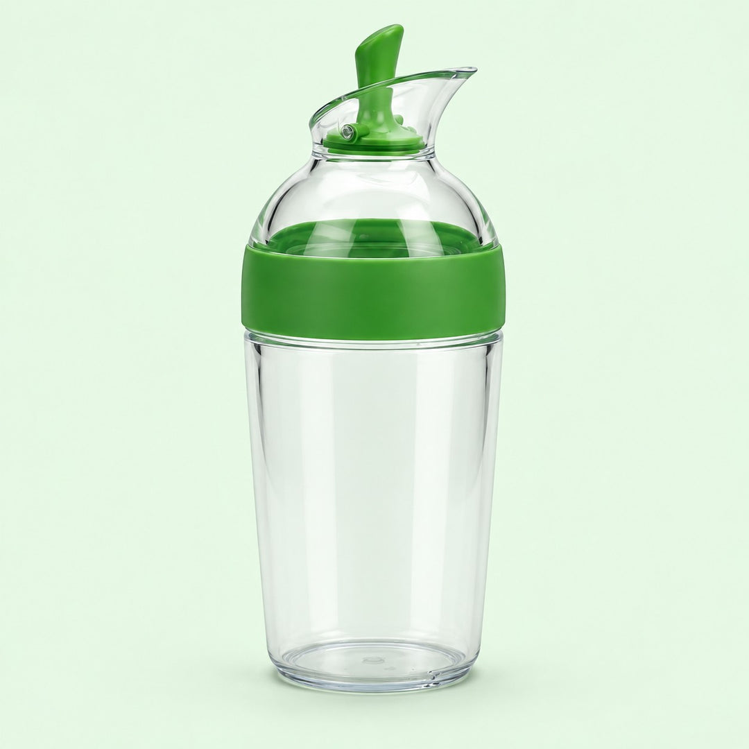 Green 240 ml Salad Dressing Shaker stands centered against a soft mint studio background.