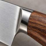 Close-up shows the brushed stainless steel blade and brown wood-grain handle with metal bolster.