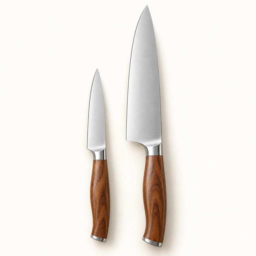 Fruit and chef knife pair with stainless blades and brown handles on a cream studio backdrop.