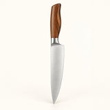 Single stainless steel chef knife with a brown wood-grain handle on a cream backdrop.