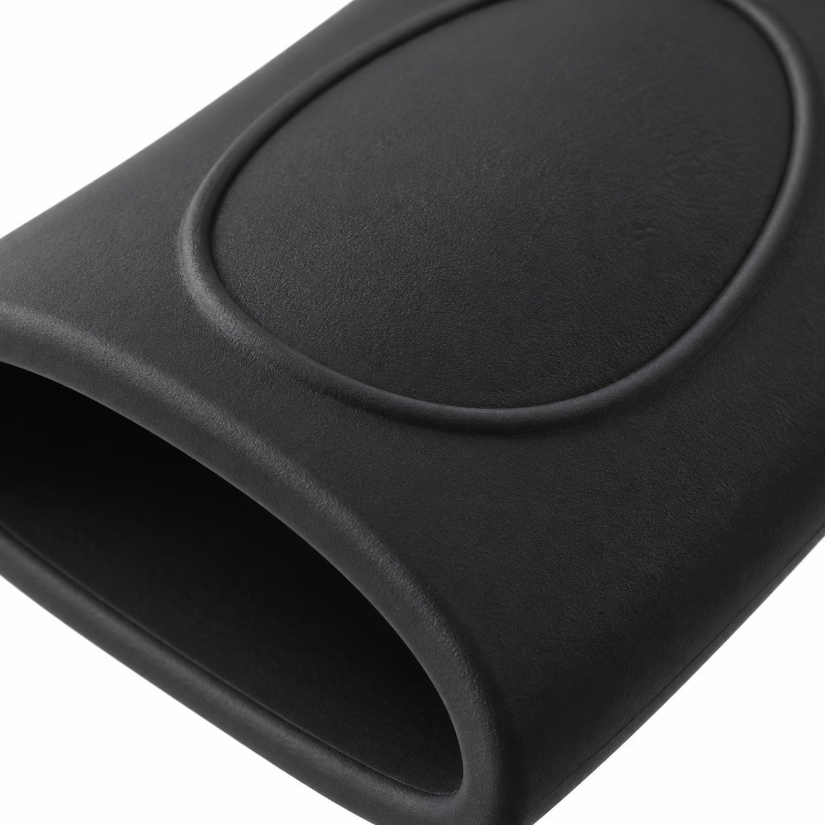 Macro view of the black silicone pot handle cover shows its matte finish and molded grip texture.