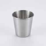 A brushed stainless steel cup with a tapered cylindrical shape, shown on a clean light gray background.