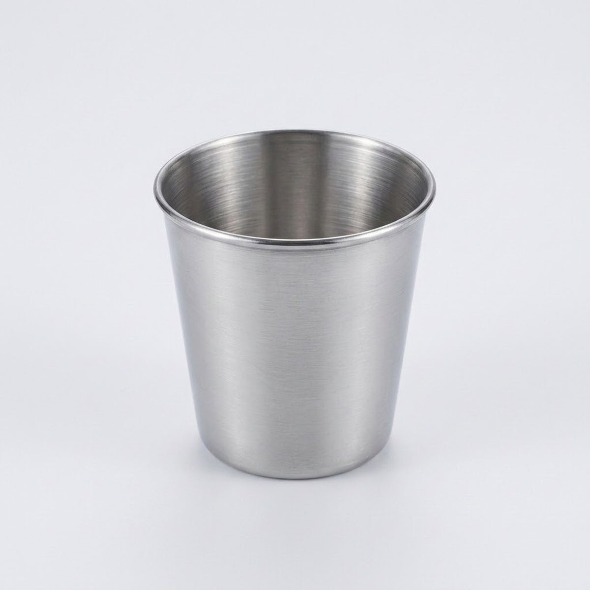A brushed stainless steel cup with a tapered cylindrical shape, shown on a clean light gray background.