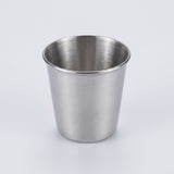 A brushed stainless steel cup with a tapered cylindrical shape, shown on a clean white background.