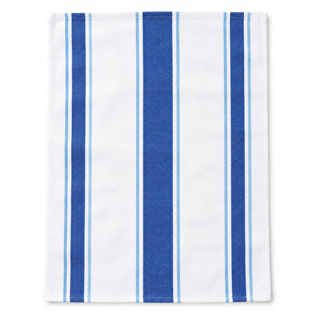 One blue striped cotton tea towel lies alone on a white studio background.