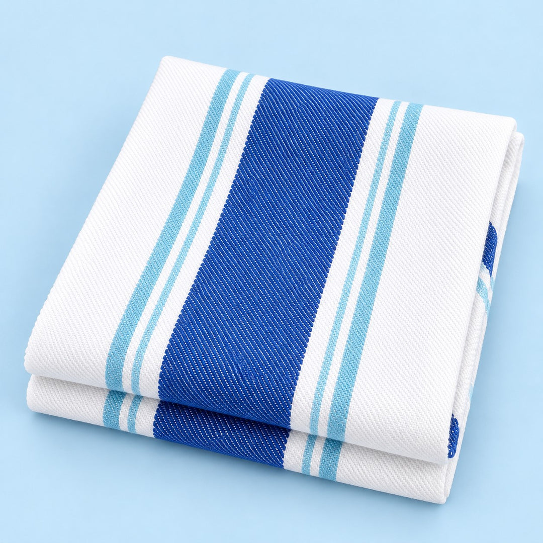 Blue striped cotton tea towel folded on a pale blue studio background.