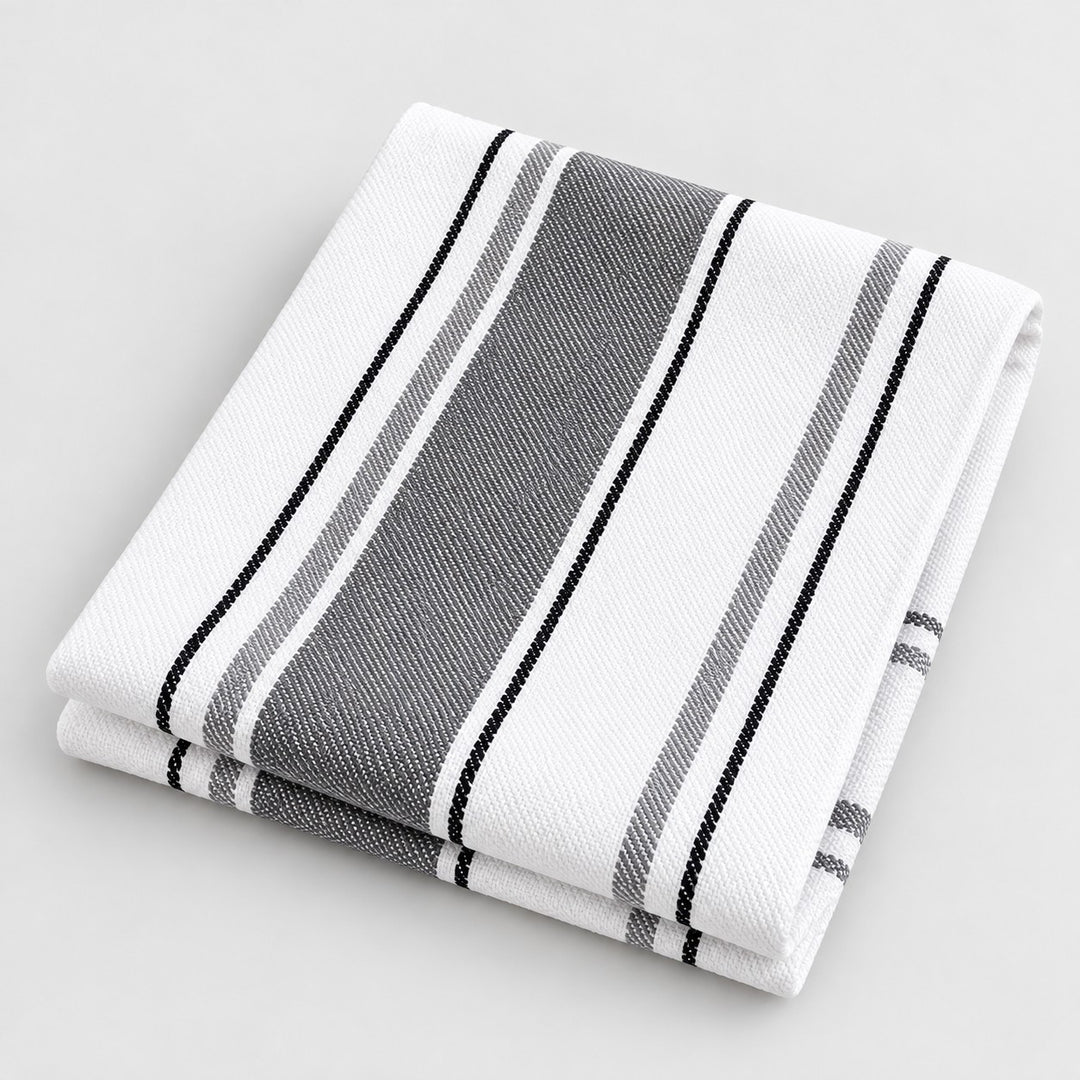 Gray striped cotton tea towel folded on a light gray studio background.