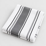 Gray striped cotton tea towel folded on a light gray studio background.