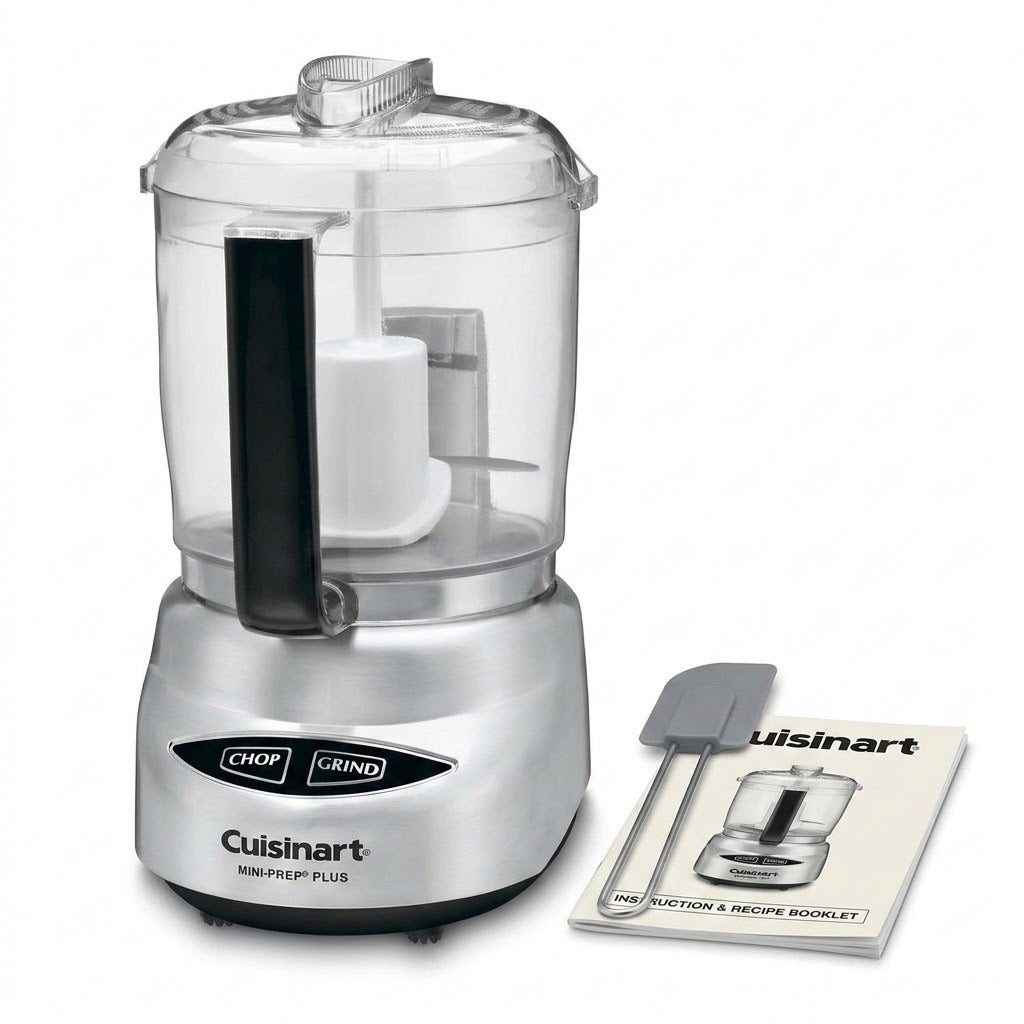 Cuisinart Mini Prep Plus food processor with a clear plastic bowl, silver base, black handle, and a small instruction booklet and spatula on a white background.