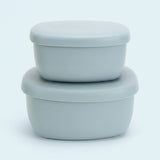 Two light gray silicone storage containers with matching lids, stacked neatly on a clean white background.
