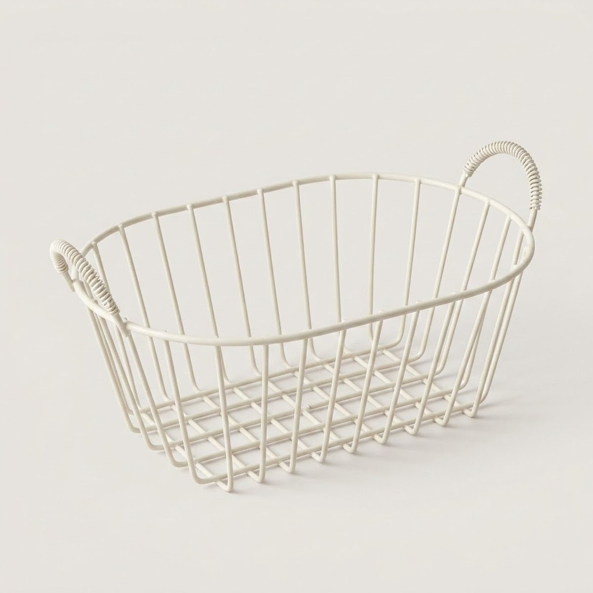 An oval metal wire basket with rope-style handles, shown on a plain light beige background.