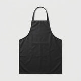 A black bib apron with a single neck strap and a front patch pocket, shown flat against a light gray background.