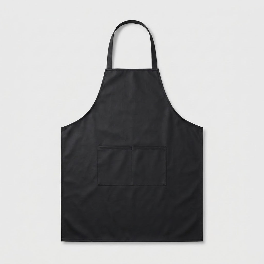 A black bib apron with a single neck strap and a front patch pocket, shown flat against a light gray background.