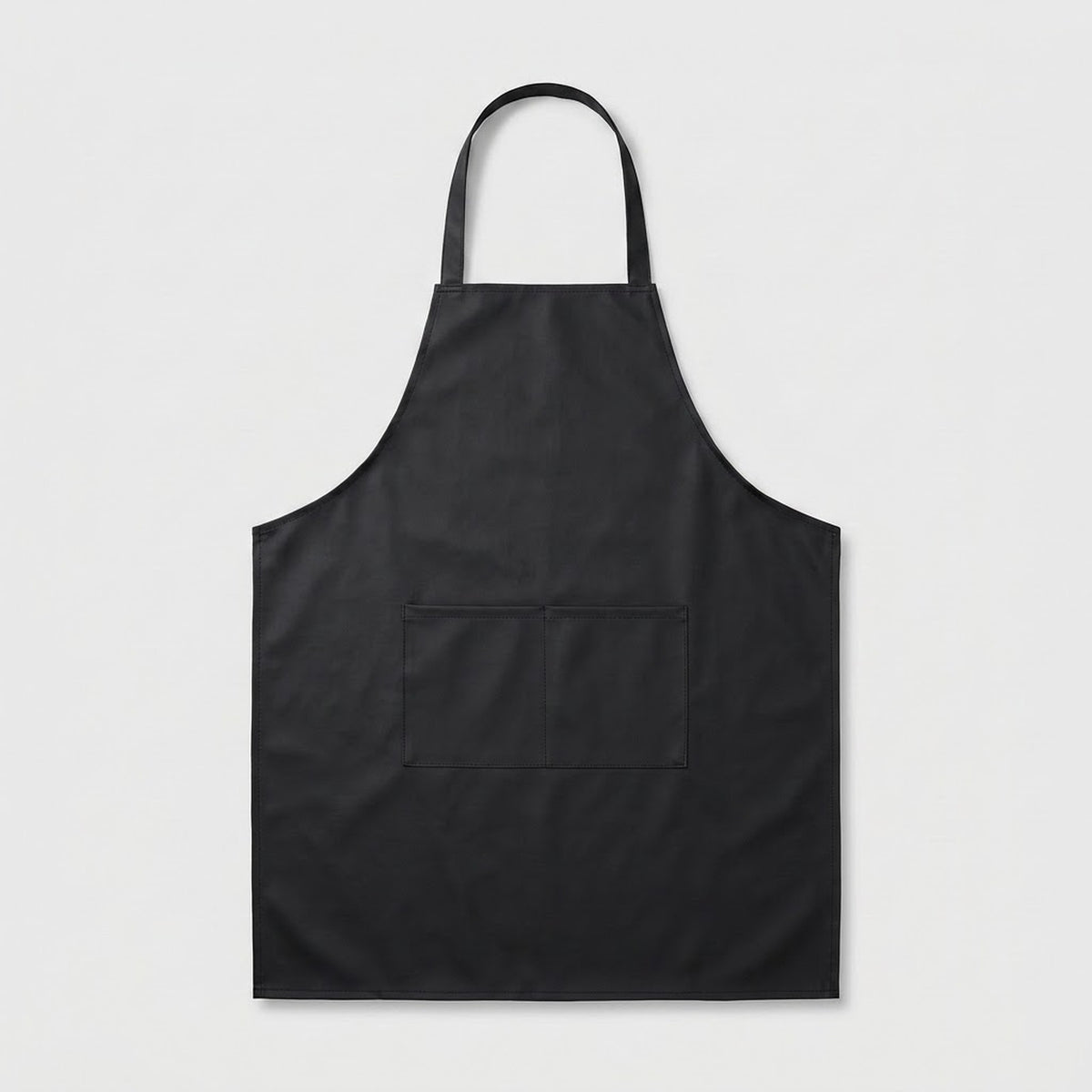 A black bib apron with a single neck strap and a front patch pocket, shown flat against a light gray background.