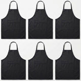Six black bib aprons with neck loops and front pockets, arranged in a 2x3 grid on a plain white background.