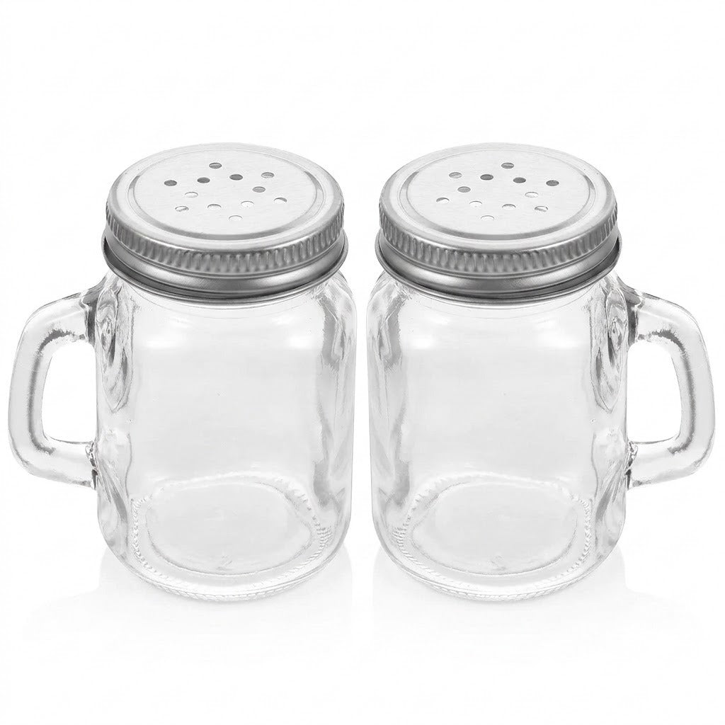 Two clear glass mason jar mugs with metal salt and pepper shaker lids, shown side by side on a white background.