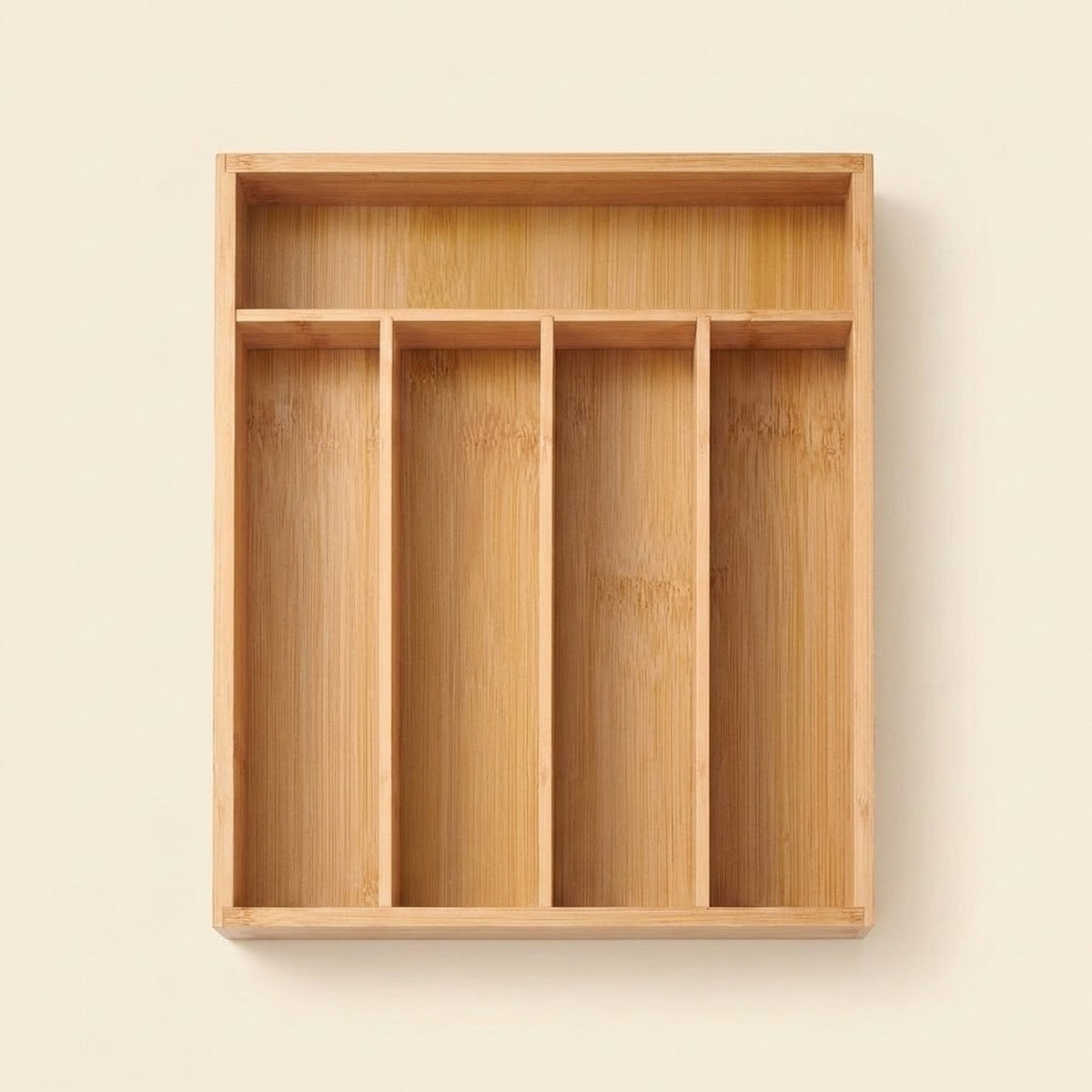 A rectangular bamboo organizer tray with four vertical compartments and a top shelf, shown against a plain beige background.