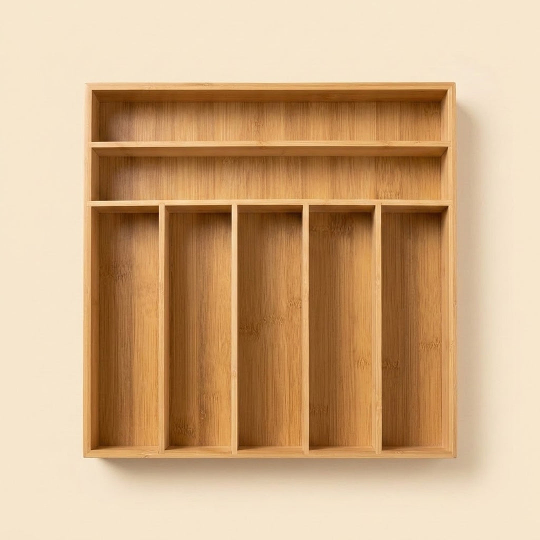 A light natural wood wall-mounted organizer with five vertical compartments and two upper shelves, shown against a plain beige wall.