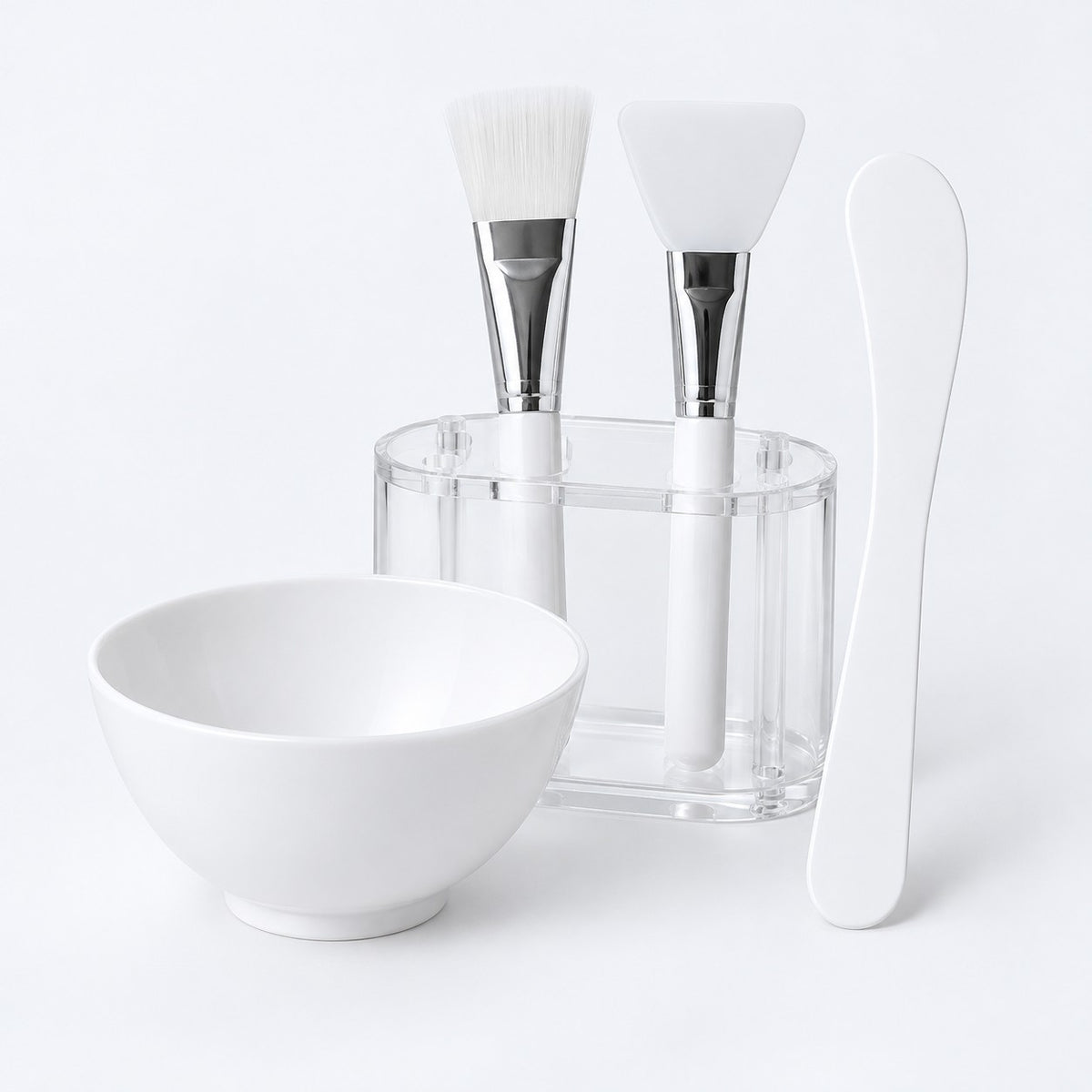 Two-applicator face mask mixing bowl set with bowl, spatula, brush, silicone tool and holder.