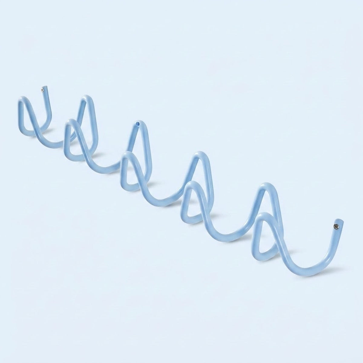 A light blue spiral wire coat rack hook displayed diagonally on a clean, solid pale blue background.