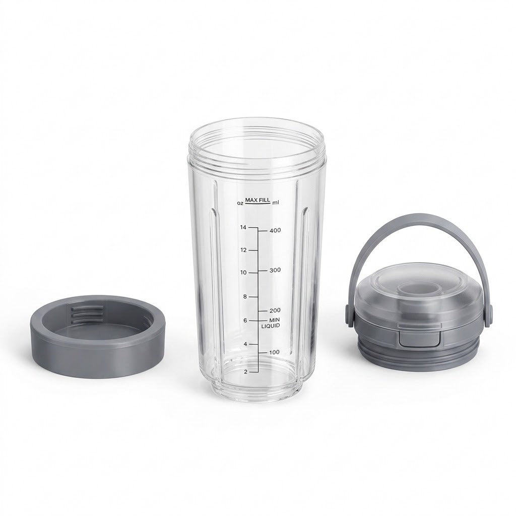 A clear plastic travel tumbler with black measurement markings, shown with a gray screw-on lid and a gray carrying handle on a white background.