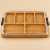 The Six-Compartment Charcuterie Board has six bamboo sections under a clear lid.