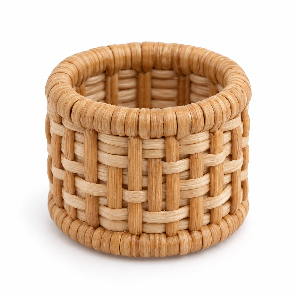 One natural tan basket-weave rattan napkin ring shown alone against a white background.