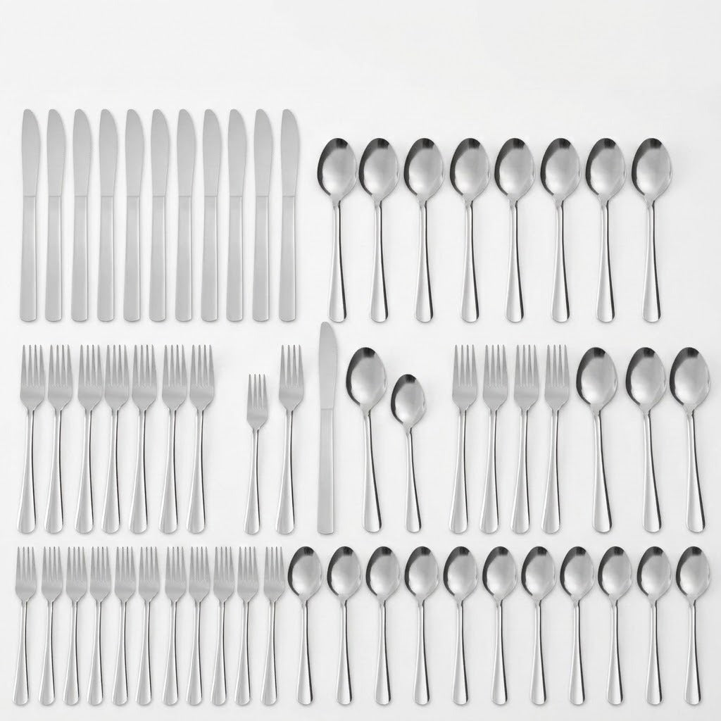 A large flat-lay collection of stainless steel cutlery, including knives, forks, and various sizes of spoons, neatly arranged in rows on a plain white background.