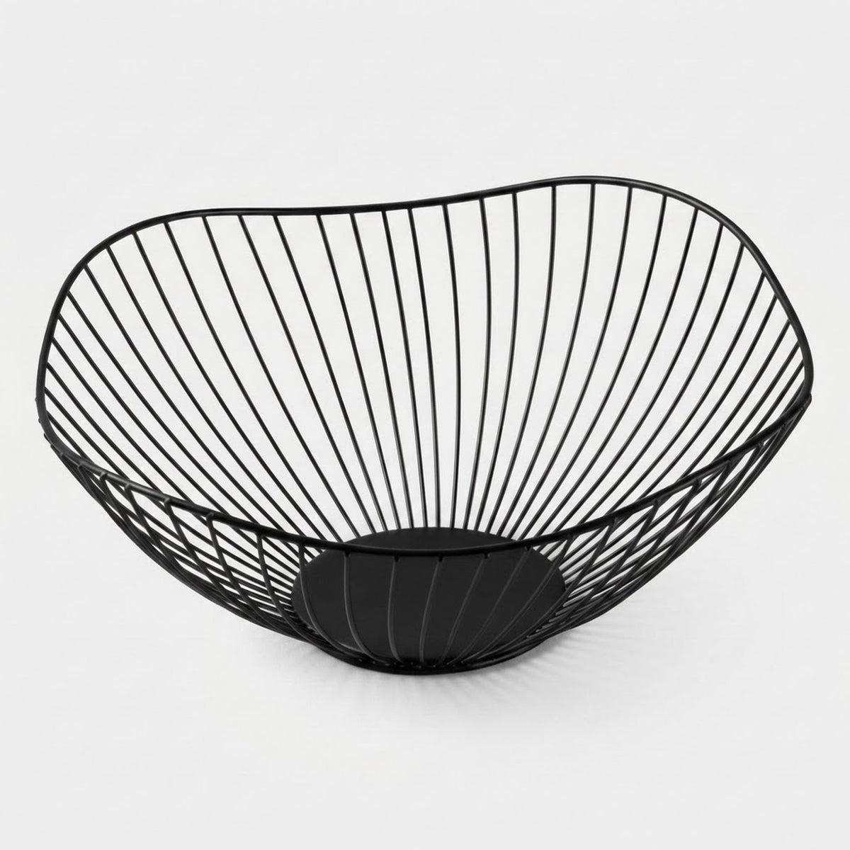 A black wire bowl with a curved, basket-like structure and a circular base, shown on a clean light gray background.